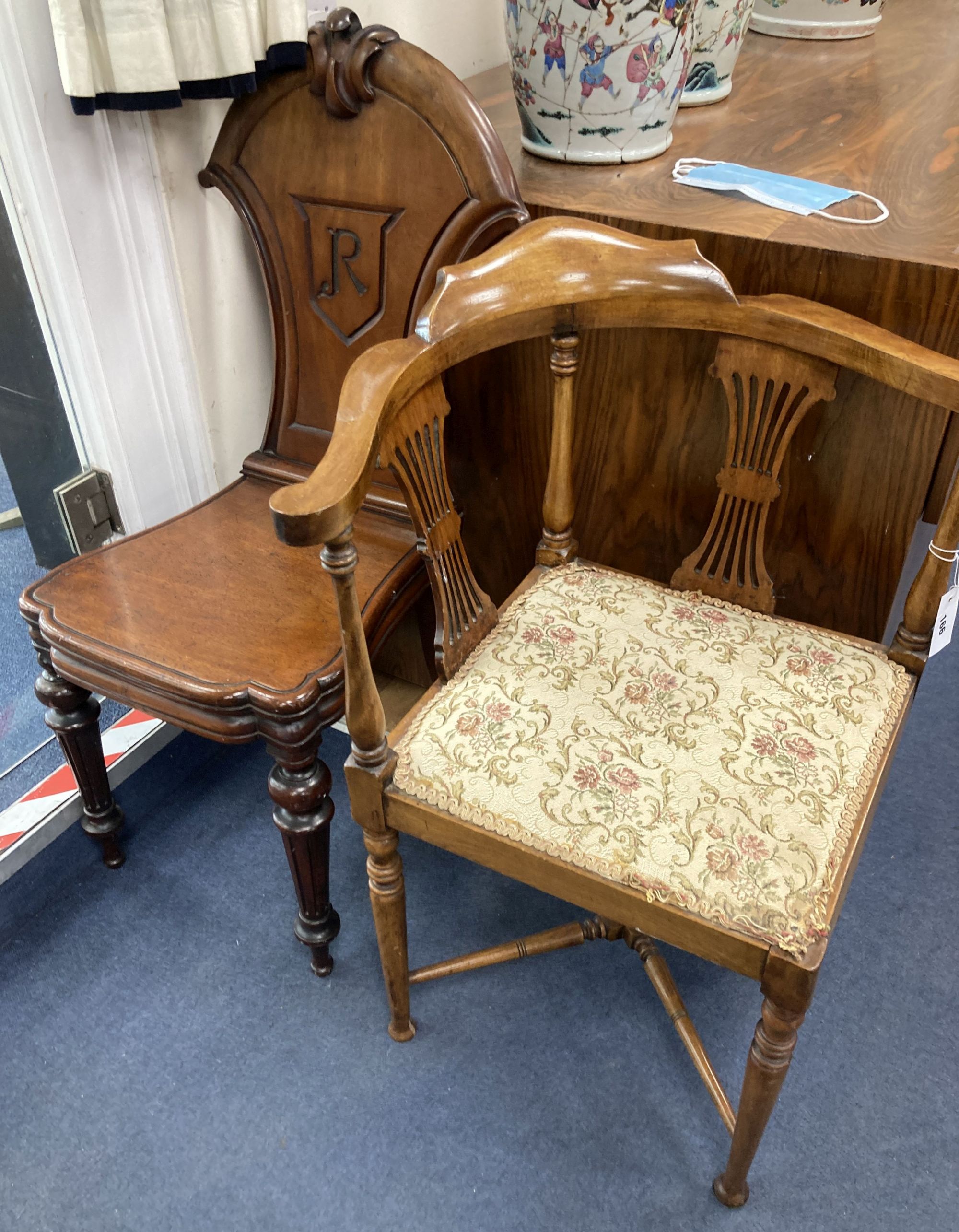 A Victorian mahogany hall chair and an Edwardian mahogany corner elbow chair